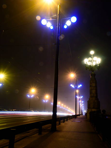 istock Stone Bridge lights in fog ,Riga 526650895