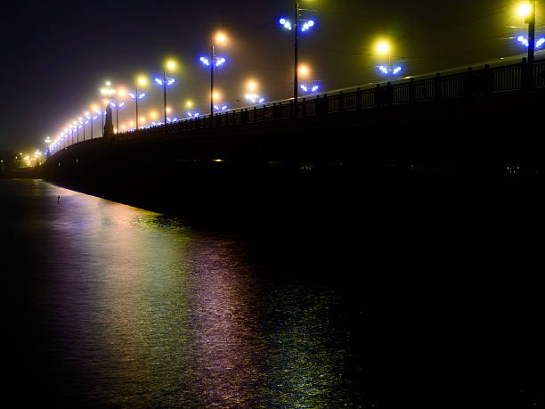 istock Stone Bridge lights in fog ,Riga 526650897
