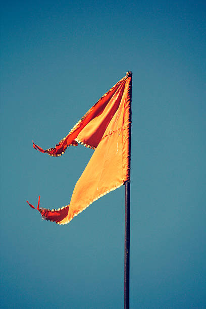 istock Orange Hindu temple flag in the breeze 526651517