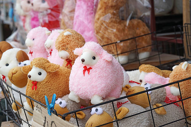 istock fluffy pink sheep doll in market 526652207