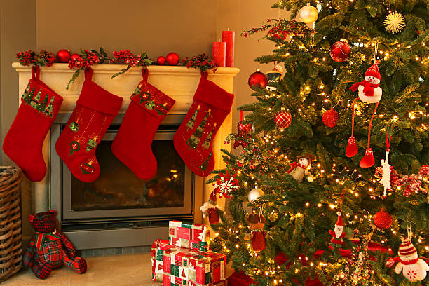 istock Christmas Tree with Presents and Stockings on Decorated Fireplace 526653743