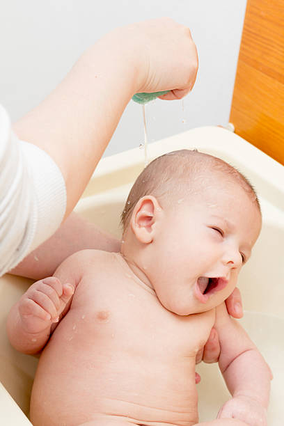 istock Newborn baby boy bathing 526665187