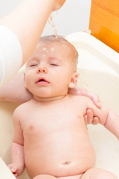 istock Newborn baby boy bathing 526665191