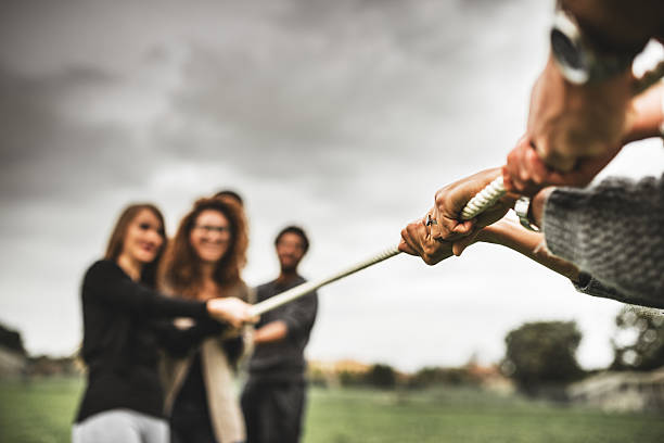 istock Friends doing the Tug of war - teamwork 526666285
