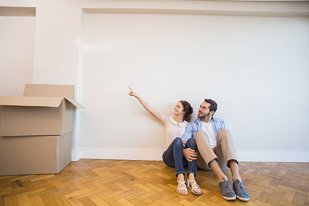 istock Cute couple pointing to the wall 526666973