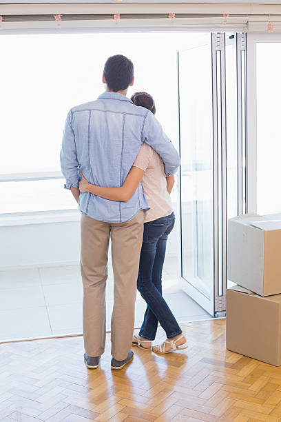 istock Cute couple looking out the window 526666979