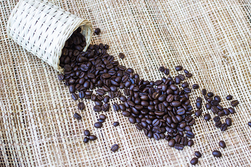 Coffee beans on Bamboo mat texture background