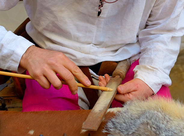 istock artisan working arrow wood, motion blur 526683683