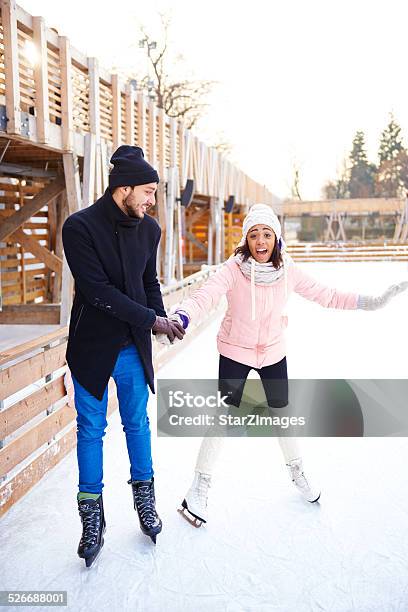 Fist Time On An Ice Rink Stock Photo - Download Image Now - Ice-skating, 20-24 Years, 20-29 Years