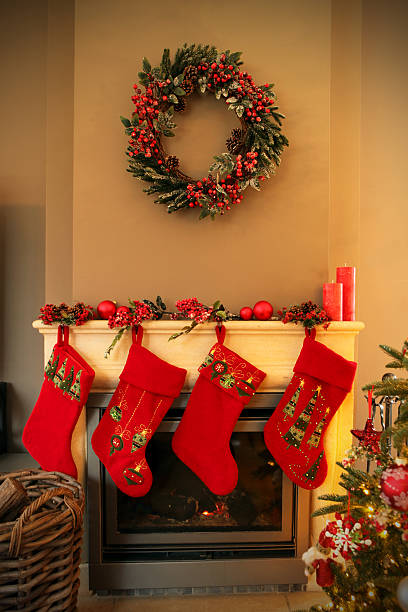 istock Christmas Fireplace Decorated with Wreath and Red Christmas Stockings 526688103