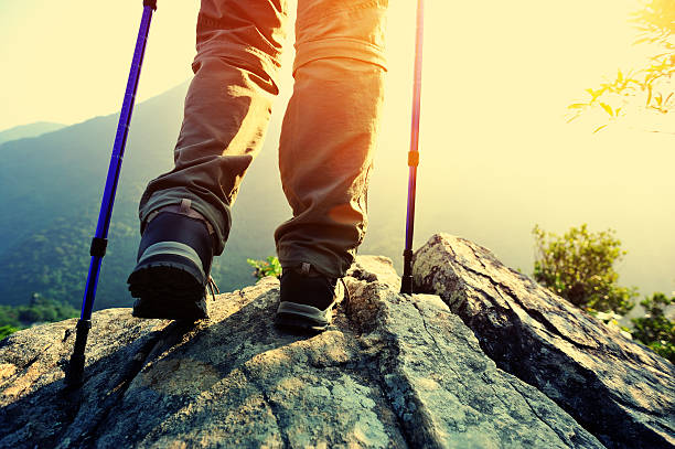 istock hiking legs mountain peak rock 526688539