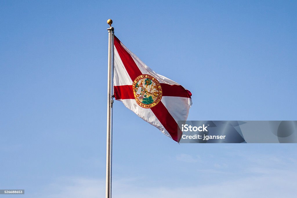 Florida State Flag Florida state flag waving in the wind on a clear day. Florida State Flag Stock Photo