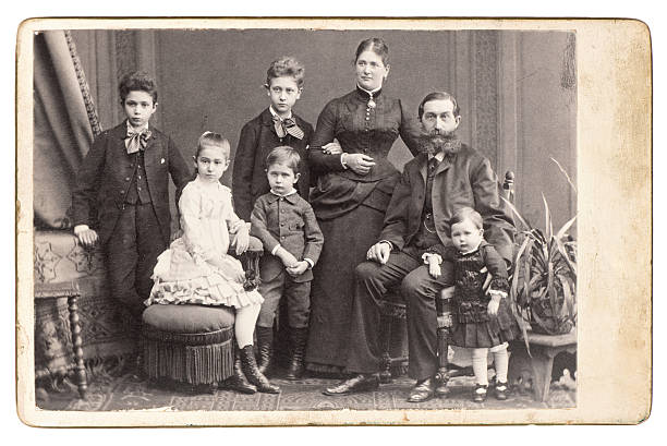 old family photo. parents with five children stock photo