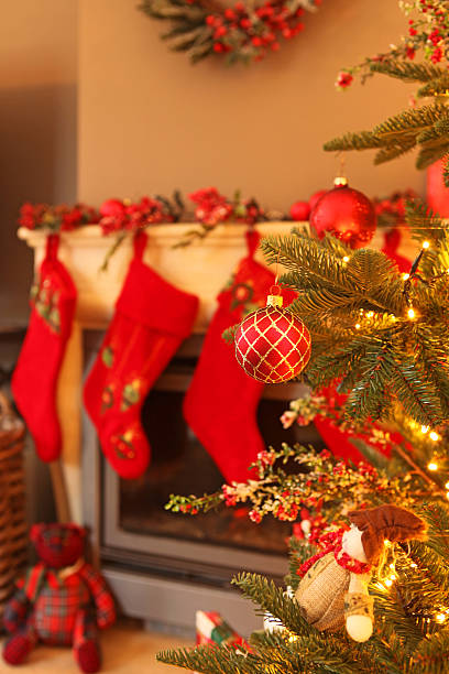 istock Christmas Tree and Mantelpiece with Red Christmas Stockings 526690127