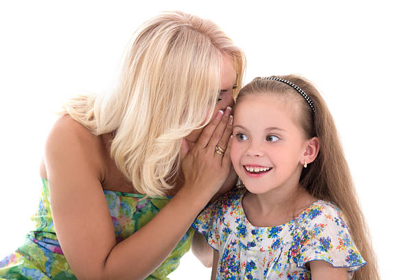 istock mother and daughter sharing gossiping isolated on white 526700843