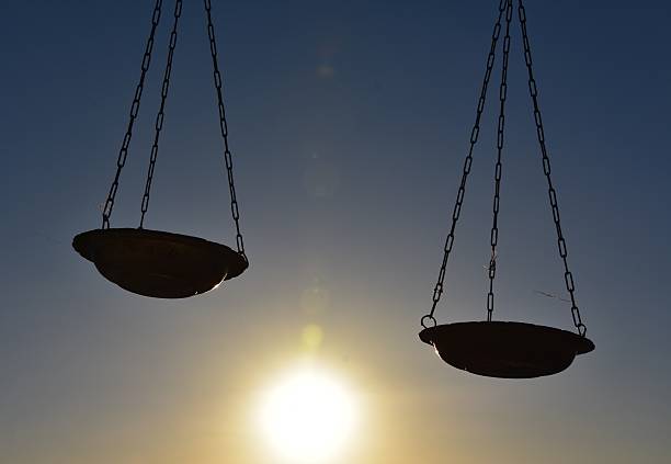 istock Scales of justice silhouette 526704342