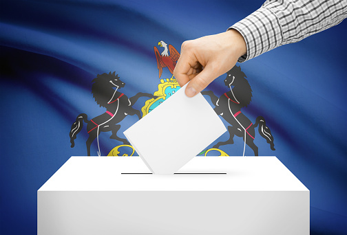 Voting concept - Ballot box with national flag on background - Pennsylvania