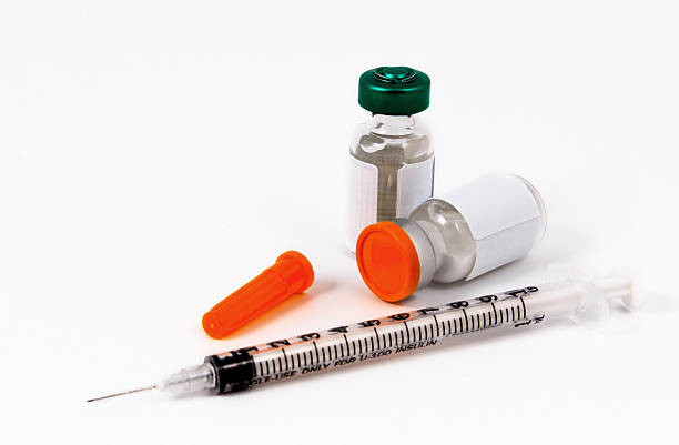 istock Vaccine in vial with syringe on a white background. 526704640