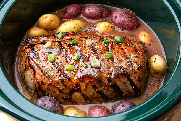 istock Delicious Pot Roast Dinner in a Crock Pot 526705019
