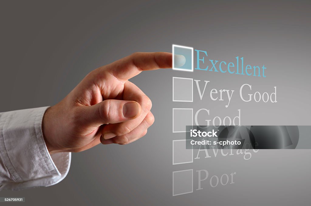 Customer survey on the touch screen, a customer choosing excellent Customer Experience Stock Photo
