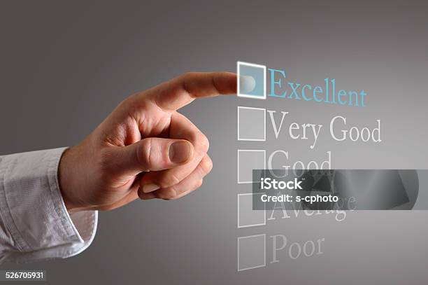 Customer Survey On The Touch Screen A Customer Choosing Excellent Stock Photo - Download Image Now