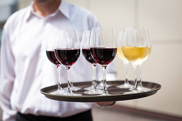istock waiter with glasses with wine on the tray 526706195
