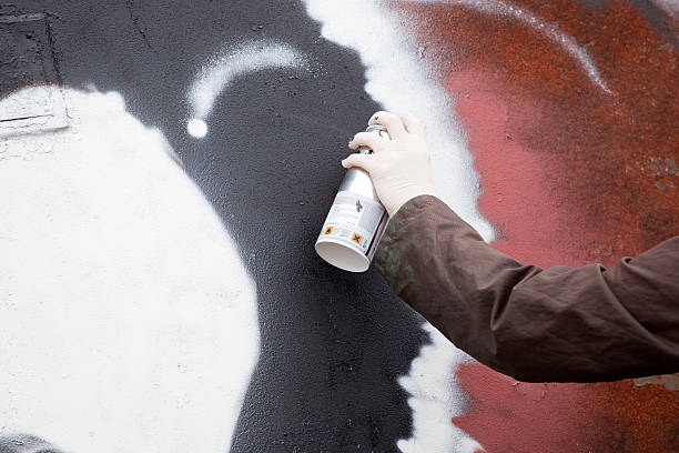 istock Graffiti artist draws on the wall 526707151
