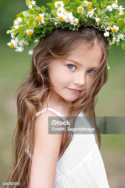 Portrait Of A Beautiful Little Girl With Flowers Stock Photo - Download Image Now - Baby - Human Age, Baby Girls, Child