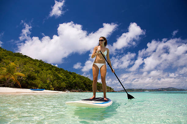 istock woman enjoying stand up paddle boarding in St.John, USVI 526707885