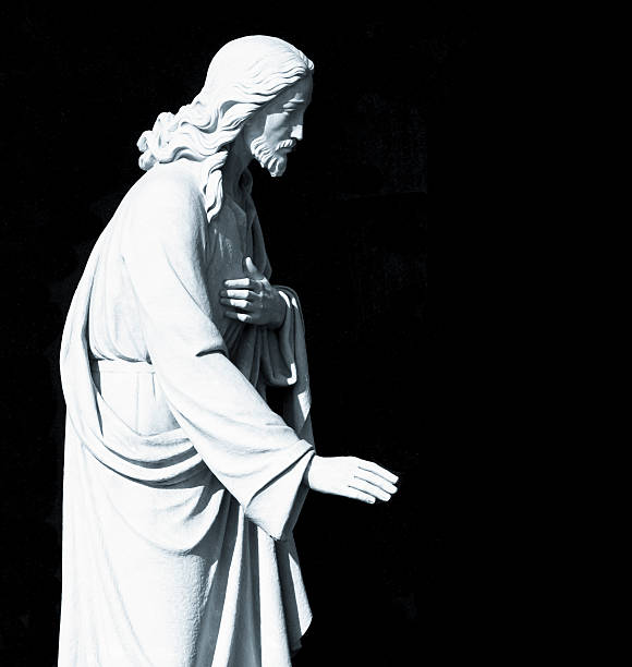 istock Statue of Jesus Christ isolated on black background copy space 526708393