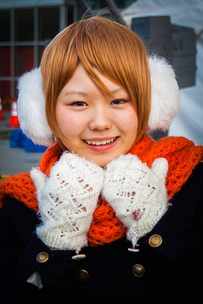 Tokyo, Japan - December 30, 2014:  A girl dressed as a character from the anime 'LoveLive!' at Comiket 87 which is the world's largest 'dojinshi' (fan made self-published works) fair and is held twice a year in Tokyo.