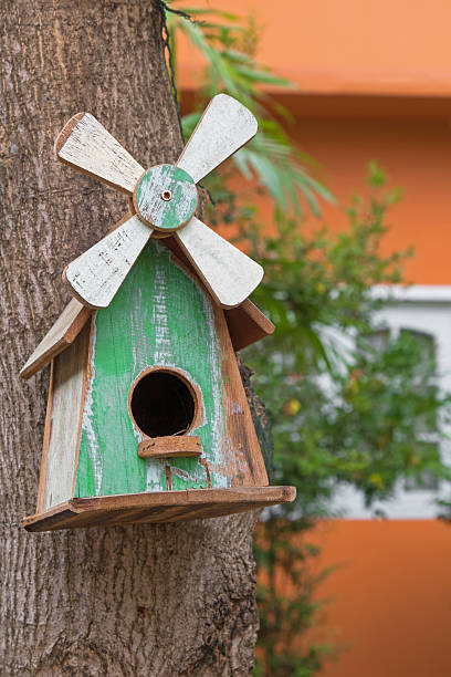 istock Handmade wooden bird house with real bird nest inside 526710490