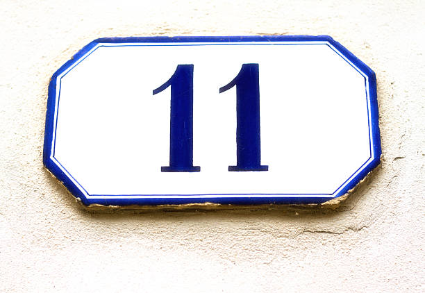 istock Number 11 Ceramic Street Address Tile On White Wall 526714542