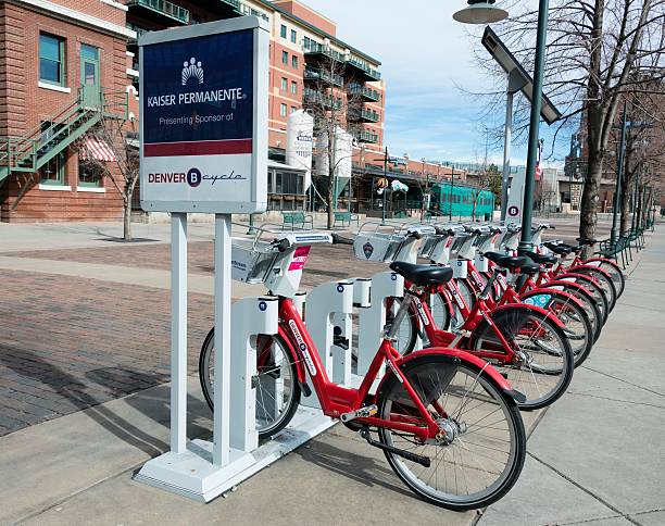 Denver, Colorado, USA - February 16, 2014: A Denver B-cycle station by Coors Field where you can rent a bike to get around town. The presenting sponsor is Kaiser Permanente, a health care organization.