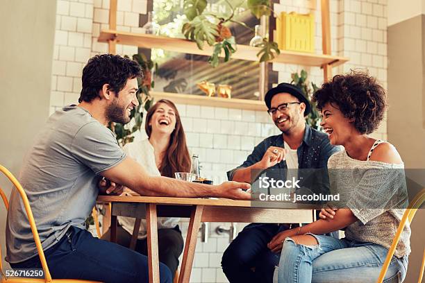 Young Friends Having A Great Time In Restaurant Stock Photo - Download Image Now - Friendship, Coffee - Drink, Talking