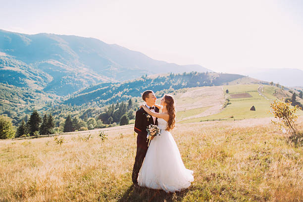istock The bride and groom are standing in the meadow alone 526716714