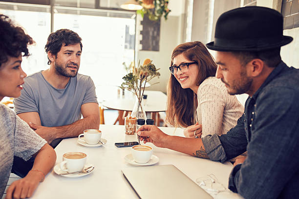 istock Friends having a discussion over a cup of coffee 526716828