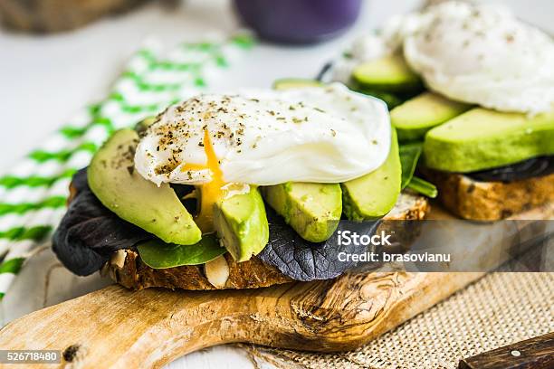 Healthy Sandwich With Avocado And Poached Eggs Stock Photo - Download Image Now - Avocado, Bread, Breakfast