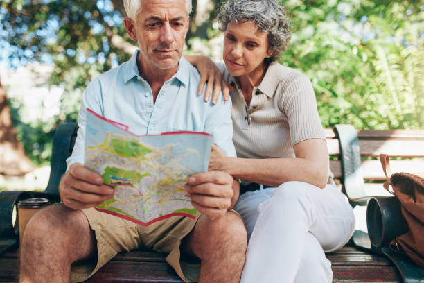 istock Senior tourist sitting on a park bench 526718834
