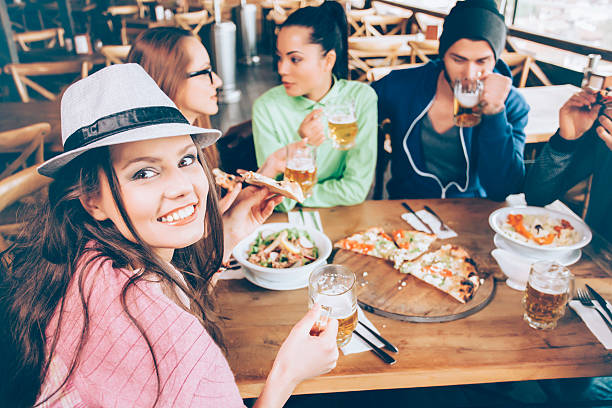 istock Friends having fun in a bar together 526721134
