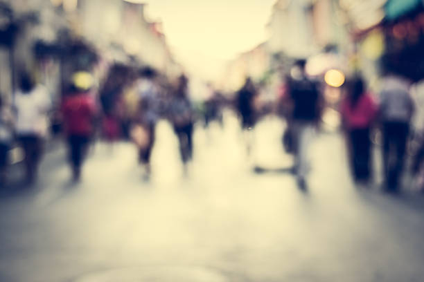 istock Blurred people walking on the street 526721650