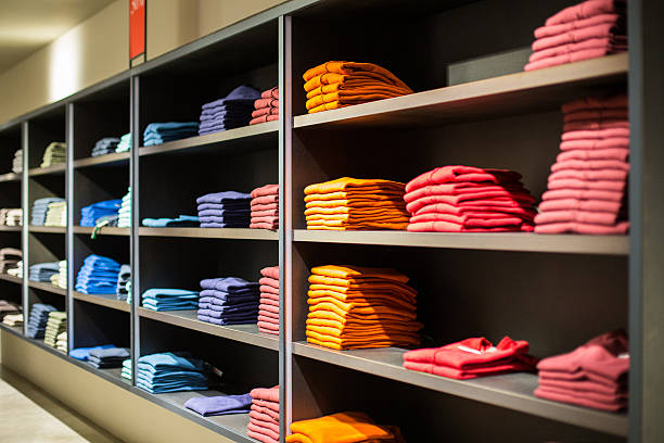 Folded colorful clothes in the department store