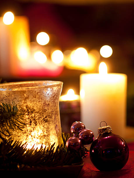 istock Red christmas ball ornaments with burning candles (shallow dof) 526722585