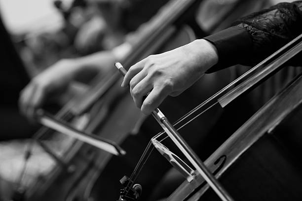 istock Hand girl playing the cello closeup 526723102