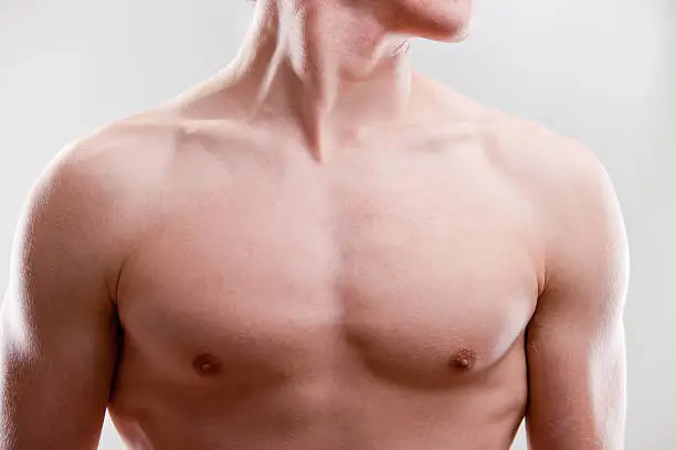 focus on chest and neck of a young strong man