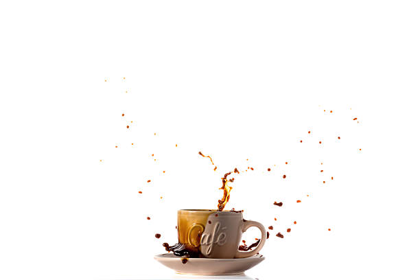 istock Cup of Spilling black Coffee Creating a Splash 526723511