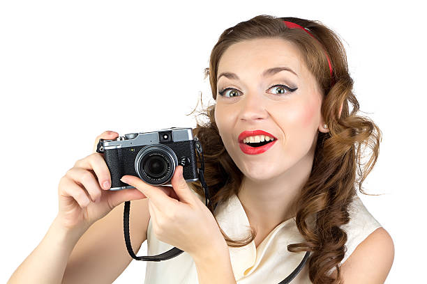 istock Image of the surprised woman with retro camera 526723927