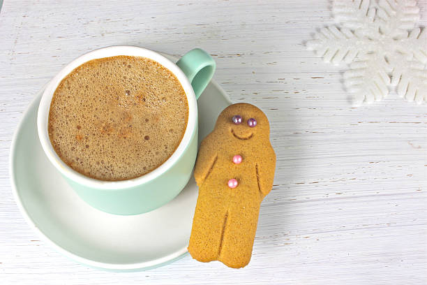 istock Gingerbread man and coffee Christmas snack on rustic background 526724047