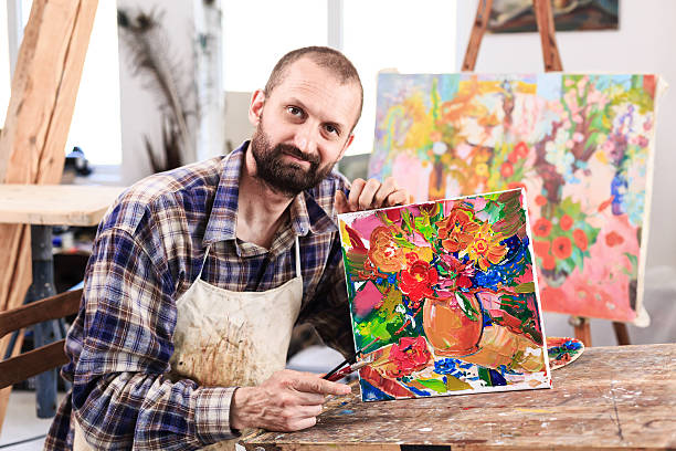 istock Fine art painer showing his artefacts 526724154