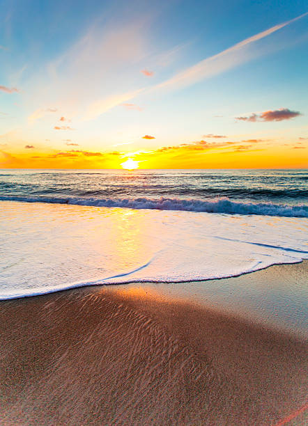 istock Sunset over ocean with white wash 526725023
